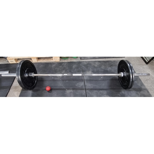 542 - An 18 kgs stainless steel Olympic weight bar with a pair of 'YORK' weights, 10 kgs each, 20 kgs tota... 