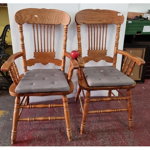 602 - A pair of heavy, high quality Colonial kitchen chairs, with an inlayed back panel depicting fleur-di... 