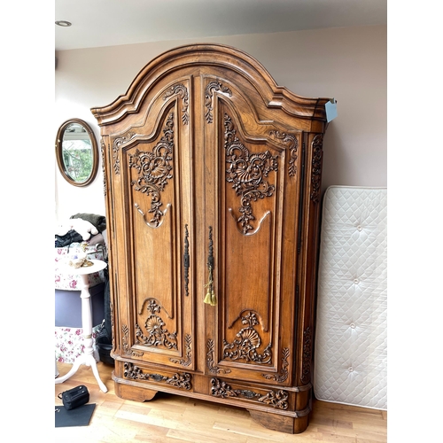 605 - Star Lot : A fantastic huge oak wardrobe with curved pediment top. Featuring lavish oak leaf and aco... 