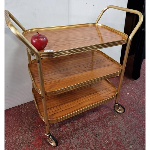 610 - A lovely looking hostess trolly, with three tiers, casters and a removeable top. Great edition to an... 