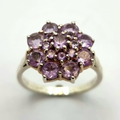 733 - A stunning sterling silver ring amethyst sunburst ring. Size Q