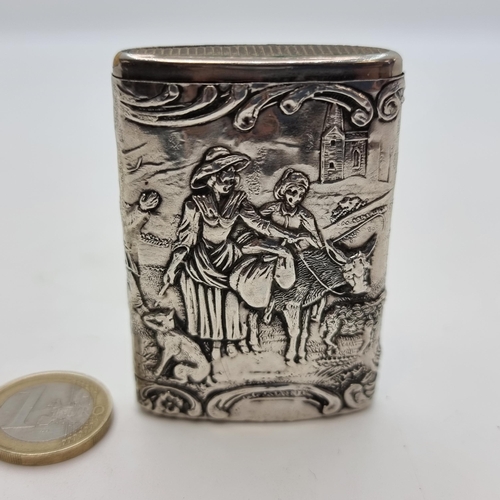 746 - A continental silver vesta case with striker to base. Featuring highly decorated detail. Silver cont... 