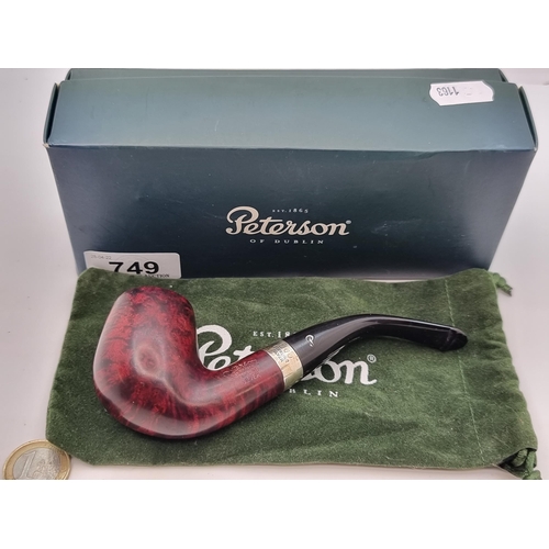 749 - A nice example of a Knapp and Peterson of Dublin briar pipe. With inlaid silver band. Comes in origi... 