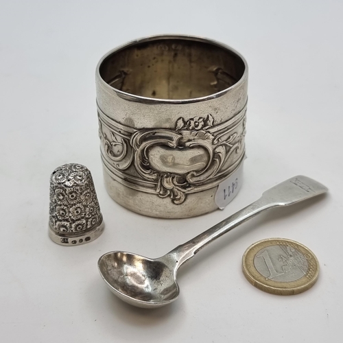 758 - Three silver items, the first a sterling silver condiment spoon, hallmarked London 1817, maker Thoma... 