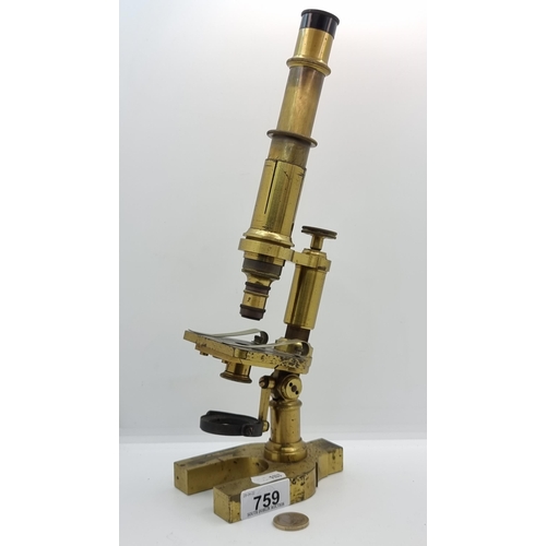 759 - A super 19th century brass microscope with heavy base. Height 33cm. According to inscription, Manufa... 