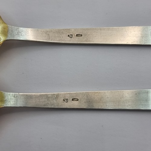 4 - A pair of vintage Russian silver teaspoons, with gilded bowls. Length of spoons 14cm. Total weight 5... 