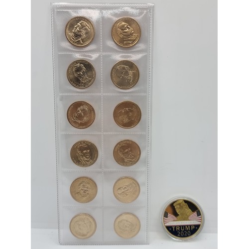 38 - A wallet containing 12 uncirculated USA one dollar coins. Depicting USA Presidents. Together with a ... 