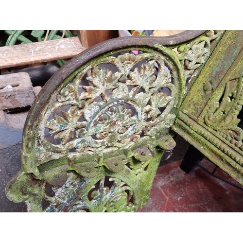 328 - Star Lot: A  magnificent example of a Victorian cast iron bench complete with bench back and bench e... 