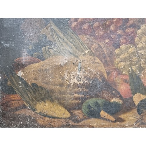 83 - A large antique original oil on canvas painting featuring a classic still life featuring bountiful p... 