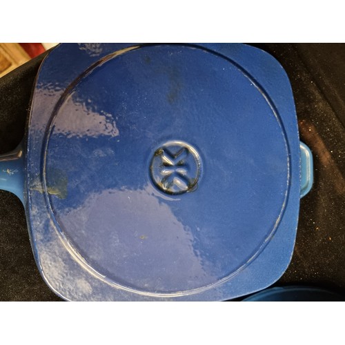 259 - A set of three cast iron blue enamelled pans, including a vintage French made Le Creuset griddle pan... 