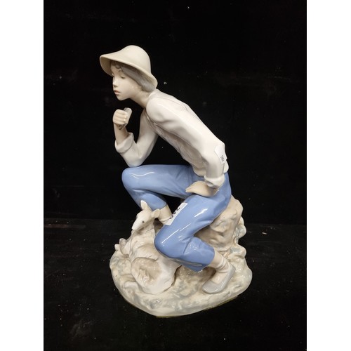 240 - A very large porcelain figure of an young man with lamb by Rex Valencia, hand painted in soft pastel... 