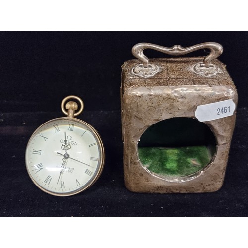 206 - Two Items including a Silver travelling clock case and a Bullseye table clock