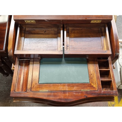 386 - Star Lot : A fabulous serpentine Davenport desk with a secret pop up top. The pull out fitted interi... 