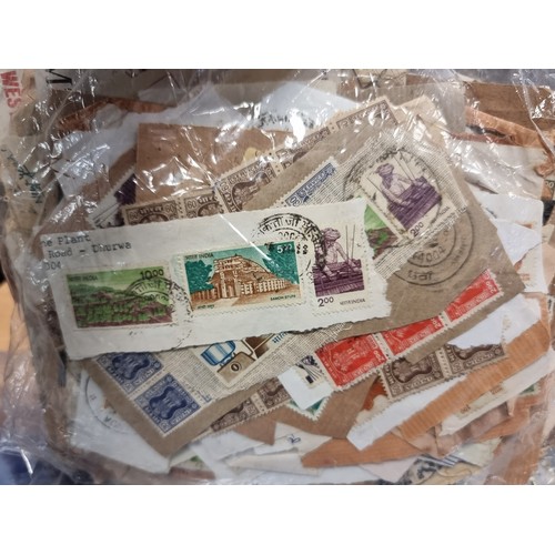 423 - An extremely large collection of assorted worldwide stamps.