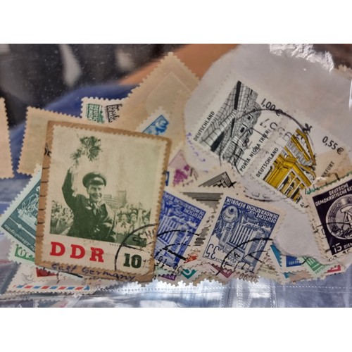 423 - An extremely large collection of assorted worldwide stamps.