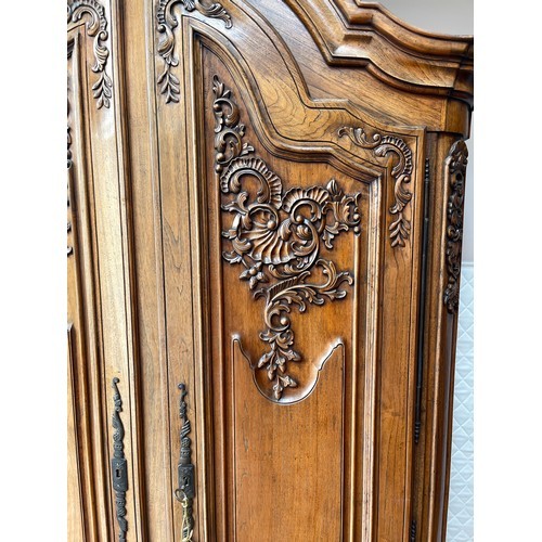 605 - Star Lot : A fantastic huge oak wardrobe with curved pediment top. Featuring lavish oak leaf and aco... 