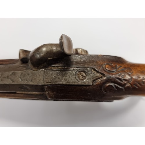 742 - Star Lot : An antique original  wooden handled flint lock pistol, with brass handled fittings. Lengt... 