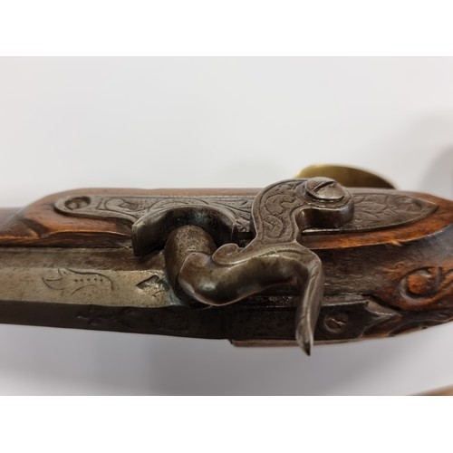 742 - Star Lot : An antique original  wooden handled flint lock pistol, with brass handled fittings. Lengt... 