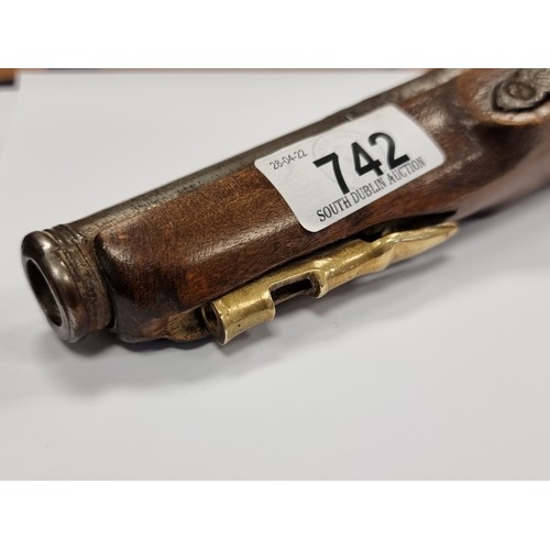 742 - Star Lot : An antique original  wooden handled flint lock pistol, with brass handled fittings. Lengt... 