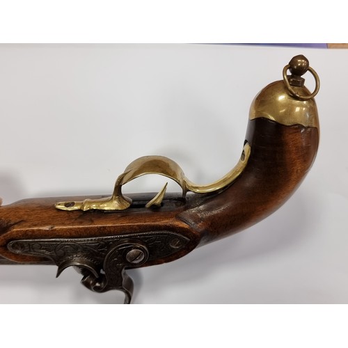 742 - Star Lot : An antique original  wooden handled flint lock pistol, with brass handled fittings. Lengt... 