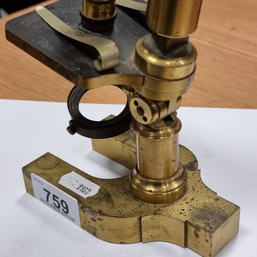 759 - A super 19th century brass microscope with heavy base. Height 33cm. According to inscription, Manufa... 