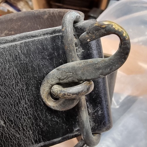 757 - Two antique leather belts, both from the Royal Irish Constabulary (1822-1922). Belts feature brass a... 