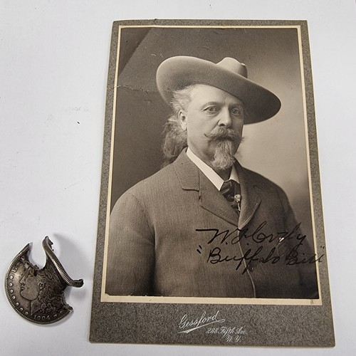 754 - Star Lot : A Wild Bill Cody (Buffalo Bill) hand signed photograph, together with a US dollar coin wi... 