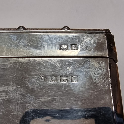 748 - A sterling silver dual cigarette box. Hallmarked London, maker and date marks indistinct. Finished w... 