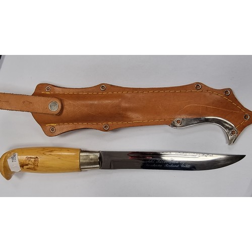 738 - A Finnish made 6'' hunting knife in a beautiful embossed genuine leather holster. Made by a famous F... 