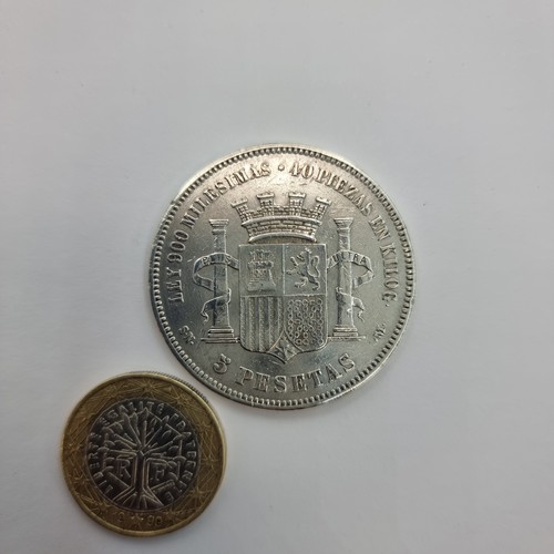 5 - A five Pesetas provisional government silver coin, dated 1870 with a silver content of .900 and a we... 