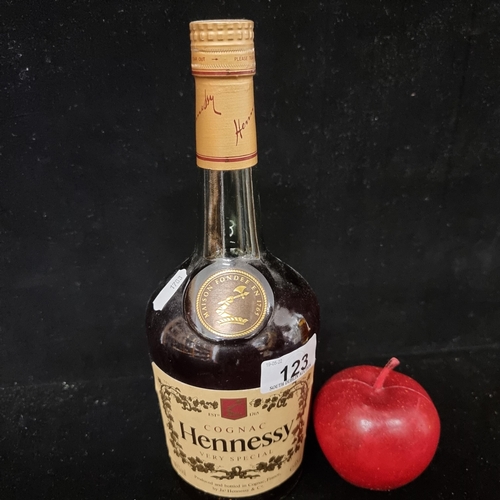 123 - A sealed 68cl bottle of Hennessy fine French cognac.