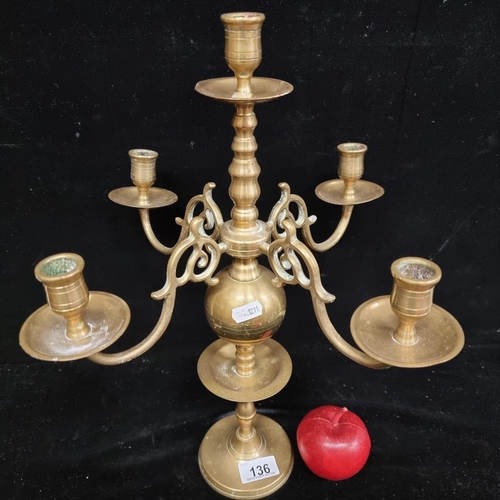 136 - A beautiful vintage Dutch style brass candelabra with a tall knopped stem and four open work scroll ... 