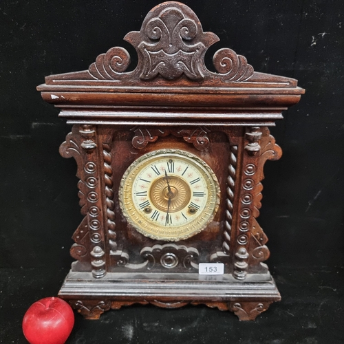 153 - A beautiful eight-day antique mantle clock by Ansonia, in the Norwich design. With a porcelain face ... 