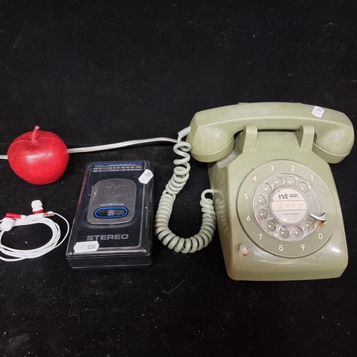 174 - Two vintage items including a 1960s Northern Telecom rotary telephone (G-Type) with a Sanyo personal... 