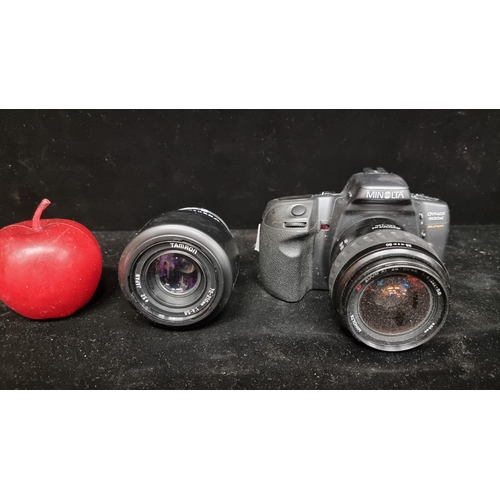 180 - Two photography equipment items including a Minolta  Dynax 500si. With 28-80mm camera lens. With a T... 