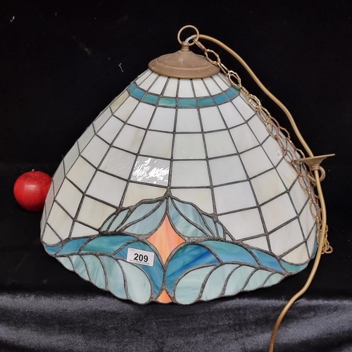 209 - A very large and impressive Tiffany style ceiling lampshade. With cobweb style lead panels and a bea... 