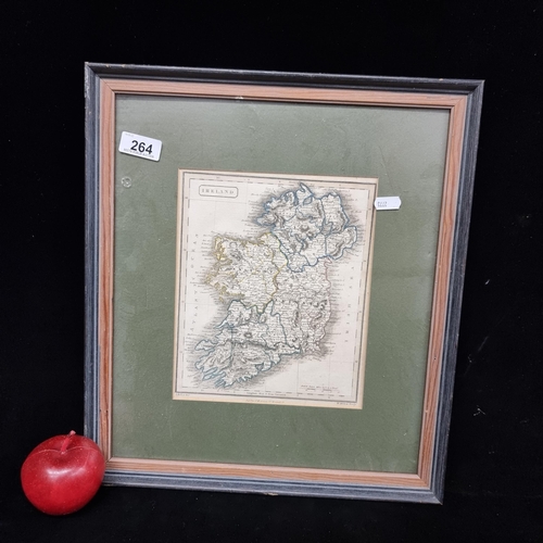 264 - A framed antique map of the Island of Ireland with hand colored details outlining province and count... 