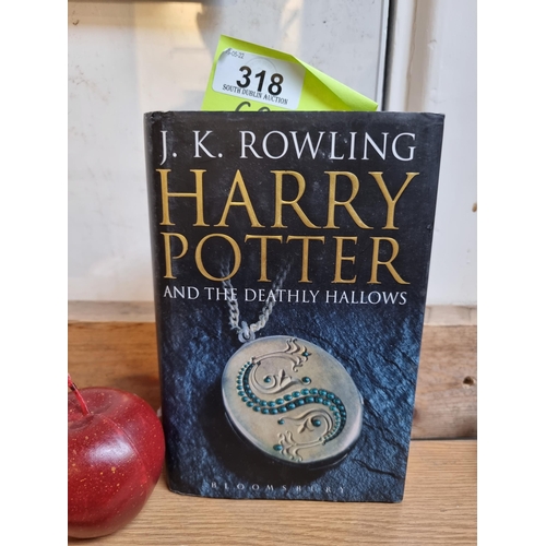 318 - A Hard back first edition copy of Harry Potter and the Deathly Hollows by J.K. Rowling, published by... 