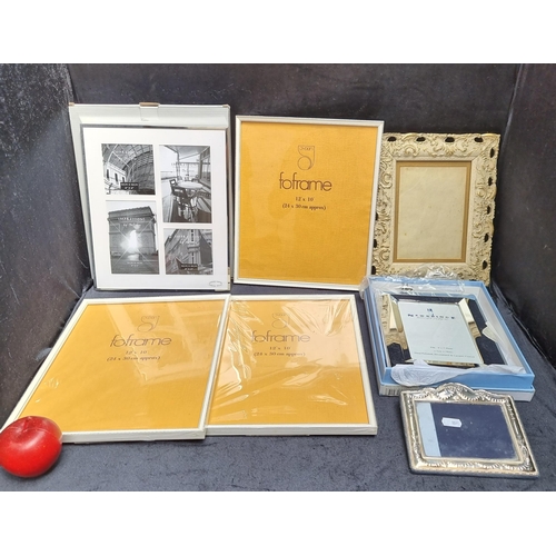 353 - A collection of seven decorative frames including a Newbridge silverware example in original box.