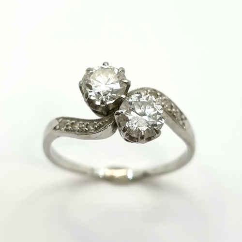 36 - Star Lot: A mesmerising 18ct white gold two twist large diamond ring.The diamonds are each .60 carat... 