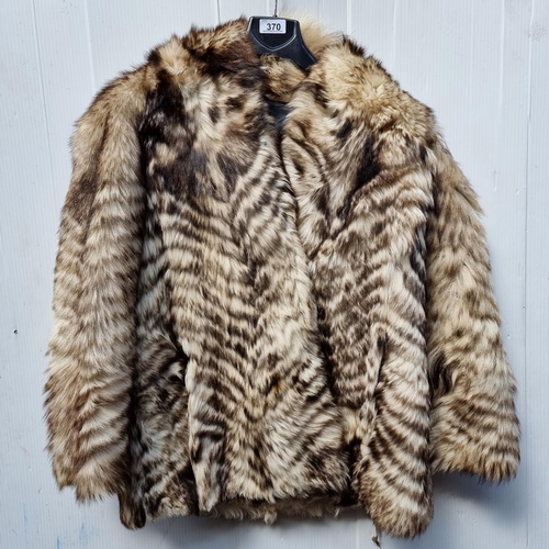 370 - A genuine vintage ladies fur jacket. Made by ''Topstyle International'' out of a blue fox fur that h... 