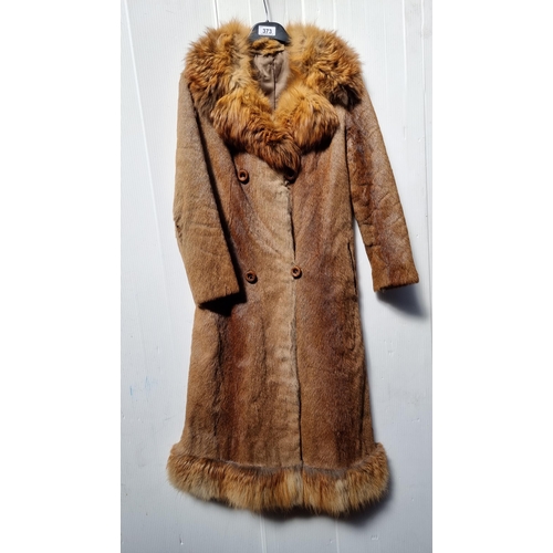 373 - A genuine ladies vintage fox fur long coat. With graduated colour throughout the pelts with feathere... 