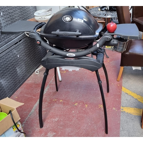 379 - A lovely Weber baby BQ9841238 portable gas bbq with temperature gauge and fold out preparation count... 