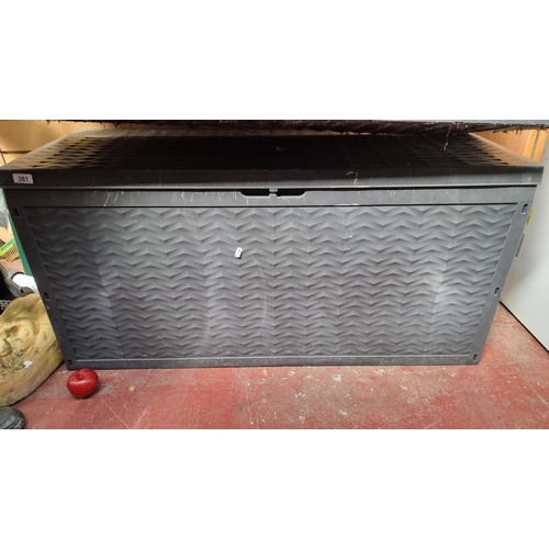 381 - A large outdoor storage box. these watertight boxes are great for keeping outdoor cushions and other... 