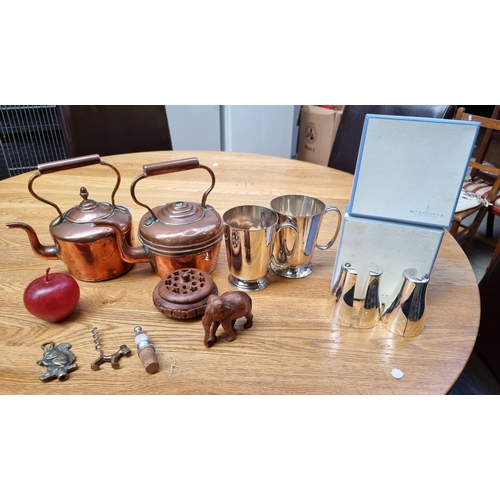 392 - A mixed lot including two vintage copper kettles, two pairs of Newbridge silverware salt and pepper ... 