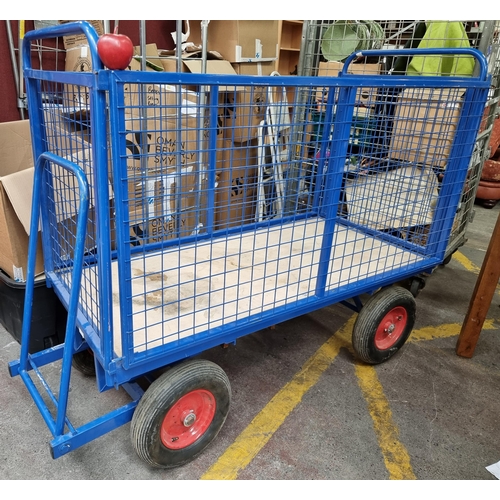 394 - A very large transport trolley in a bright blue with opening sides, on casters. Very useful piece. M... 