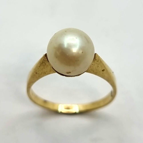 40 - An 18ct gold (stamped 750) pearl set ring. Ring size: L, size of pearl 7mm and weight of ring 2.90 g... 