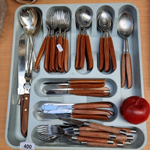 400 - A very large collection of Taylor's stainless steel cutlery with wooden handle, including a carving ... 