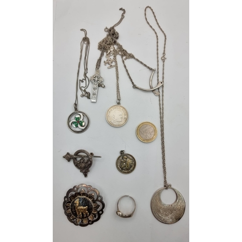 410 - A collection of silver items, consisting of pendants, necklaces and a Celtic design brooch and ring.... 