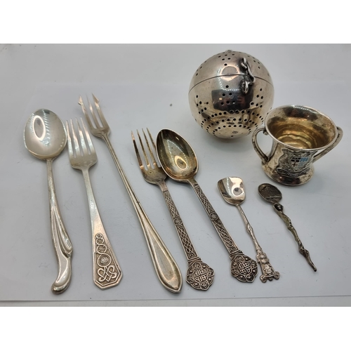 418 - A collection of assorted silver items, consisting of spoons, forks and of interest, a tea/herb strai... 